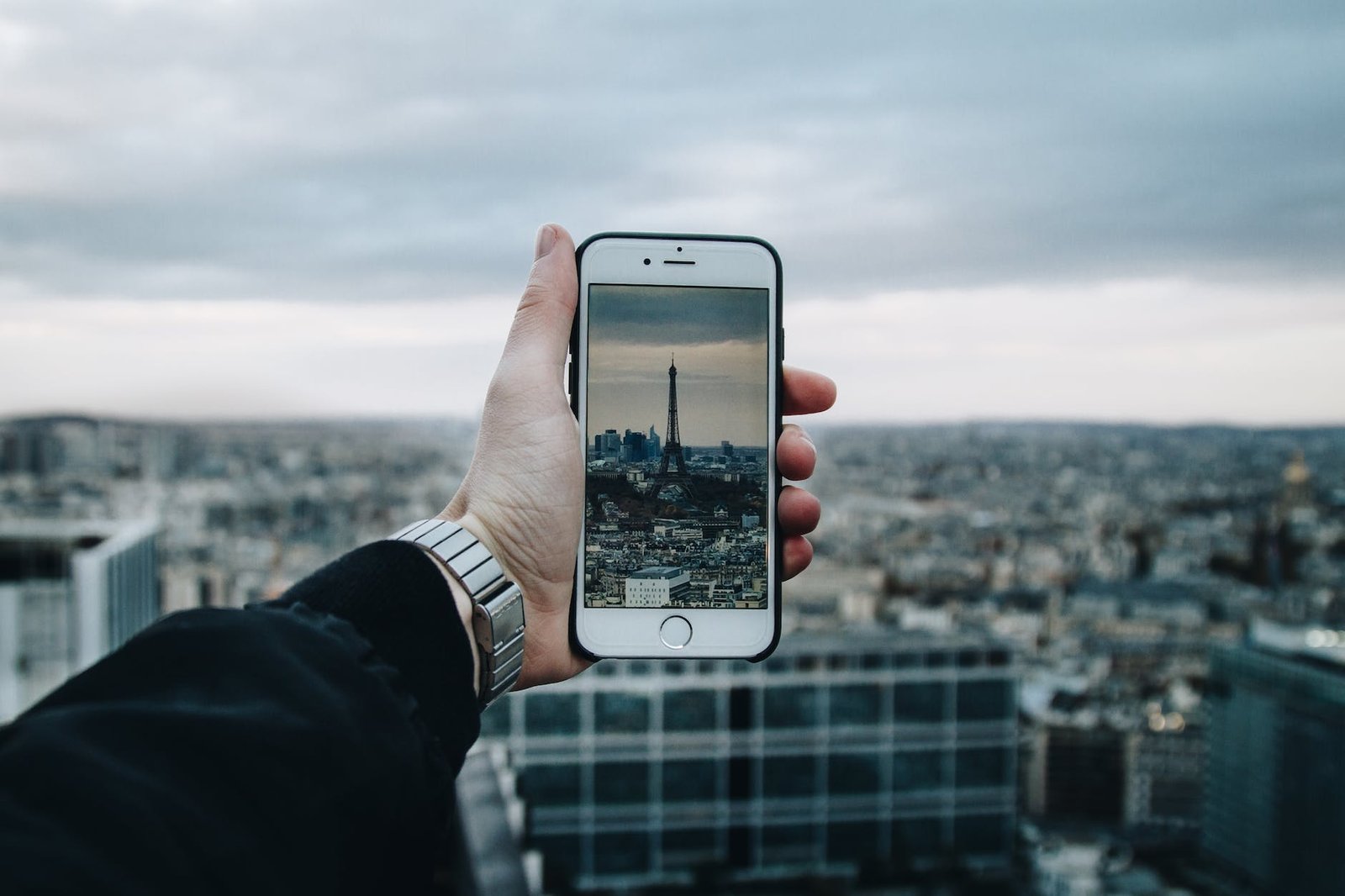 man taking picture of the city